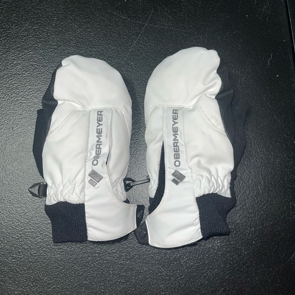 Obermeyer black and white kid’s fleece-lined mittens